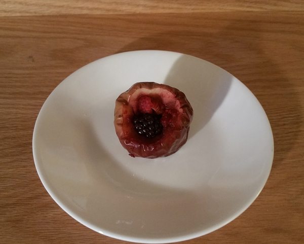 Microwave-baked apple with berries